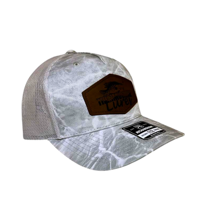 Opposite side view of the Thermocline Lures gray Mossy Oak Break-Up Infinity camo hat with a leather patch logo and adjustable back for comfort