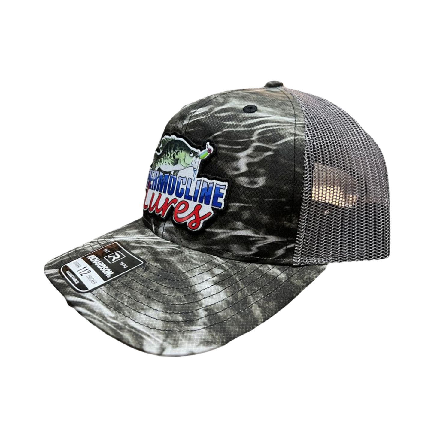 Left side view of the Thermocline Lures Mossy Oak Element Richardson 112 Trucker Hat, featuring a camouflage design and Thermocline patch.